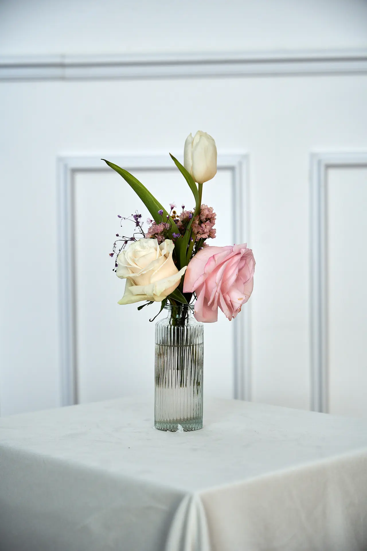 Fresh flowers in fluted vase