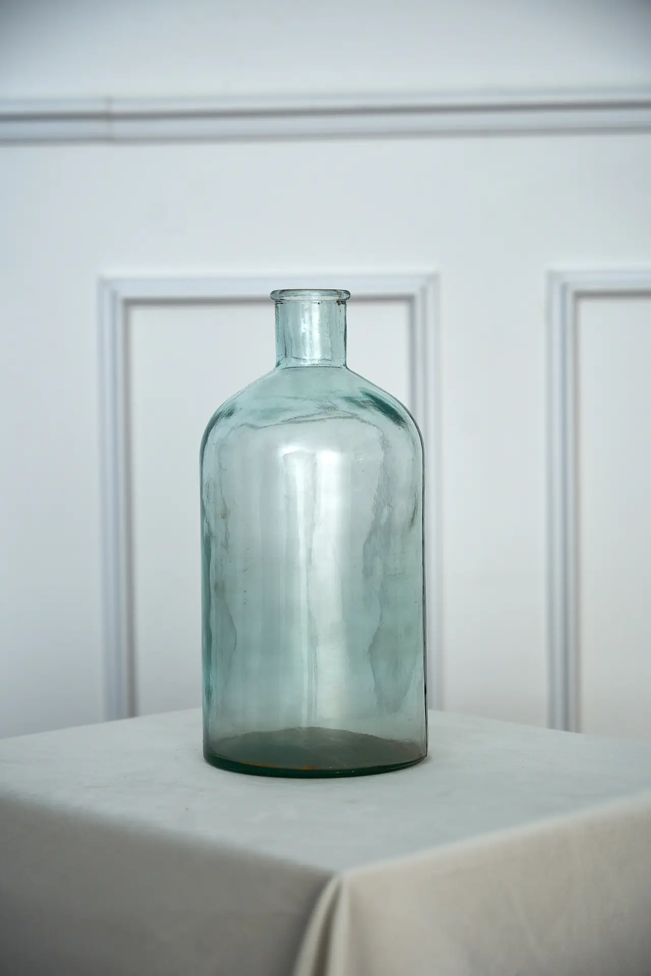 Clear glass bottle vase