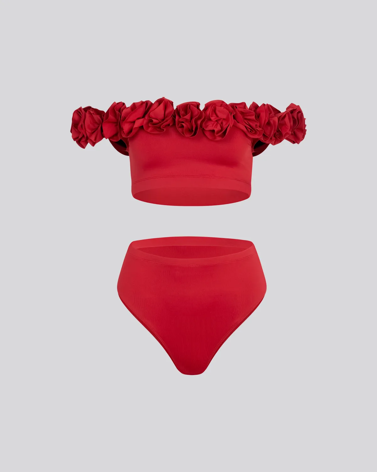 Red ruffled swimsuit packshot on a neutral background